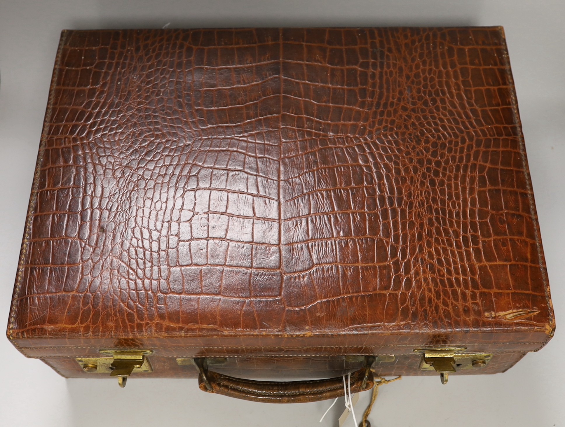 A George V crocodile skin toilet case